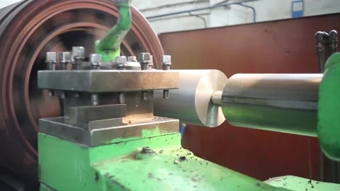 A metal round billet rotates in a lathe ... | Stock Video | Pond5