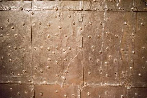 Metal rusty background with rivets Stock Photos