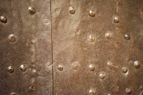 Metal rusty background with rivets Stock Photos