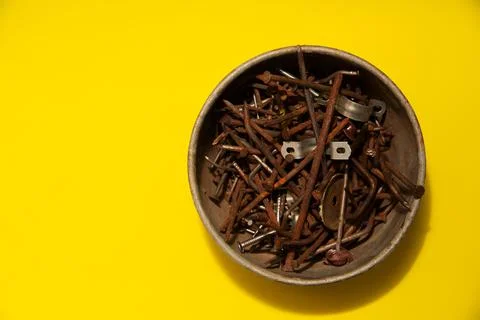 Metal rusty nails on a yellow background Stock Photos