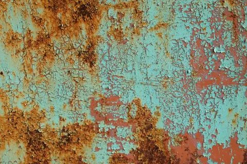 Metal rusty surface with shabby background paint. Stock Photos