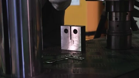 Metal sample is tested for compressive strength. Footage. Close-up of metal Stock Footage 97501422
