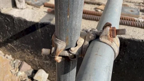Metal scaffolding pipe clamp Stock Footage 246977027