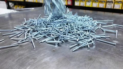 Metal Screws Falling on Workbench in Hardware Store Stock Footage 330538151