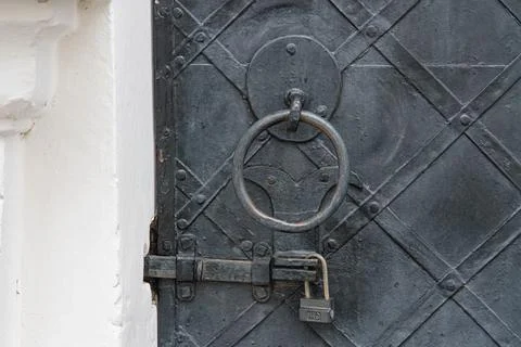 A metal security door with a grid pattern, possibly of Ukrainian origin and.. Stock Photos