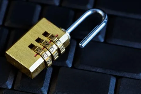 Metal security lock with password on computer keyboard Stock Photos