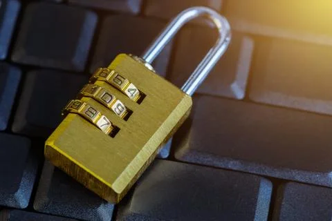 Metal security lock with password on computer keyboard Stock Photos