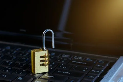 Metal security lock with password on computer keyboard Foto stock