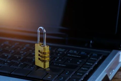 Metal security lock with password on computer keyboard Stock Photos