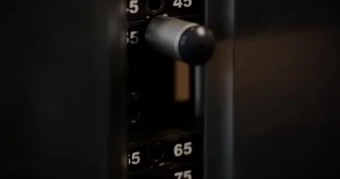 Metal Selector Pin in Weight Stack of Gym Machine, Close Up Shot Stock Footage 340366260