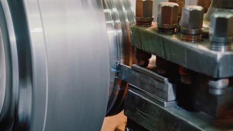 Metal shaving process on lathe machine, close-up. Works in the workshop Stock Footage 115428213
