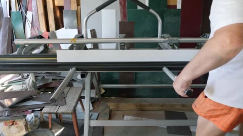 Metal sheet bending. Construction of a private house. Stock Footage 242039170