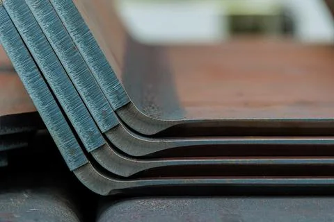 Metal sheet bent into the shape of a ready-to-use product. Stock Photos