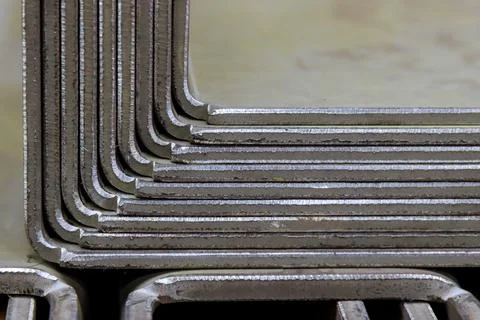Metal sheet bent into the shape of a ready-to-use product. Stock Photos