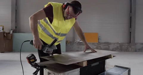 A metal sheet is cut with an angular grinder. Stock Footage 127031279