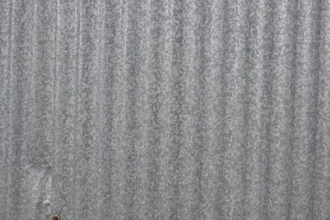 A metal sheet with a pattern of lines and dots Stock Photos