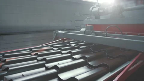 Metal sheet profile forming machine, process of making steel tile for roof Stock Footage 165572218