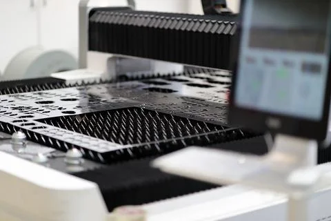 Metal sheet on work table of laser cutting machine Stock Photos
