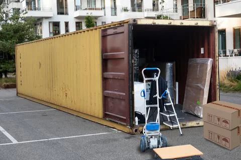Metal shipping container storage unit container with doors open parked Фото