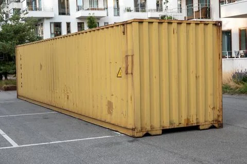 Metal shipping container storage unit container parked on a parking lot Foto stock