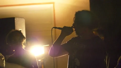 Metal Singer Screaming into a Microphone Stock Footage 219963754