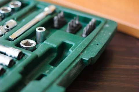 Metal socket wrench kit in a green plastic container Stock Photos