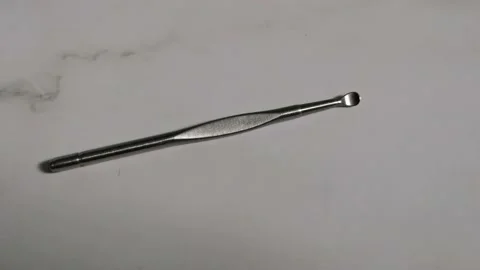 Metal Spoon for Cleaning Ears Stock Footage 205828017