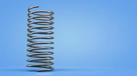 Metal spring. Blue background. Copy space. Stock Photos