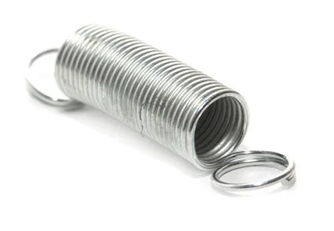 Metal spring on a white background. macro Foto stock