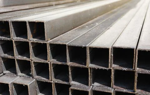 Metal square profile in a stack, metal pipes of square cross-section on the s Foto stock
