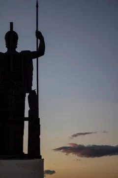 Metal statue at sunset Stock Photos