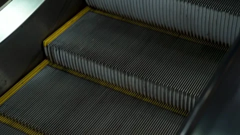 Metal steps move upward with yellow safety edges. Stock Footage 343263422