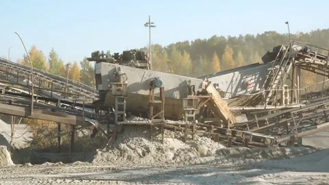 Metal stone crushing machine. Stone crushing factory. Career. Crushed granite Stock Footage 154129751