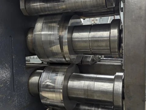 Metal Strip Processing. Large Rollers Guide Metal Strip Efficiently Through.. Stock Photos