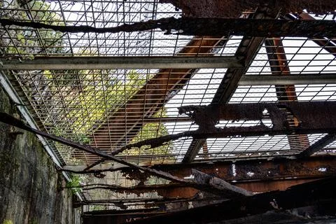 Metal structure of an abandoned bridge completely rusted Stock Photos