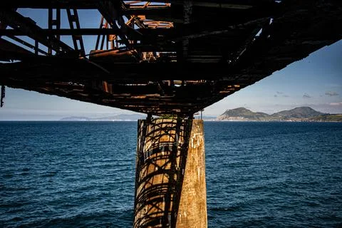 Metal structure of an abandoned bridge completely rusted Stock Photos