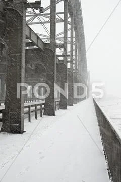The Metal Structure Of A Bridge In A Snowstorm