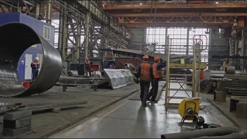 Metal structure is carried on cables at factory. Stock clip. Lifting cables move Stock Footage 281330153