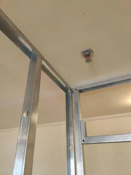 Metal structure with ceiling sprinkler installation Stock Photos