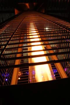A metal structure with a light shining through it Foto stock