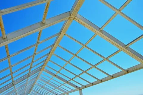 A metal structure made of square and rectangular pipes against the background 스톡 사진