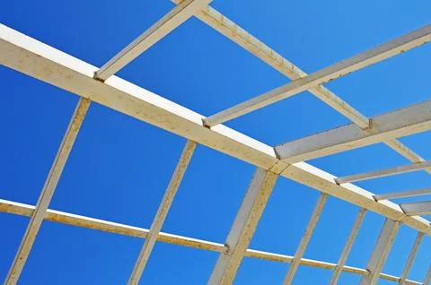 A metal structure made of square and rectangular pipes against the background 스톡 사진