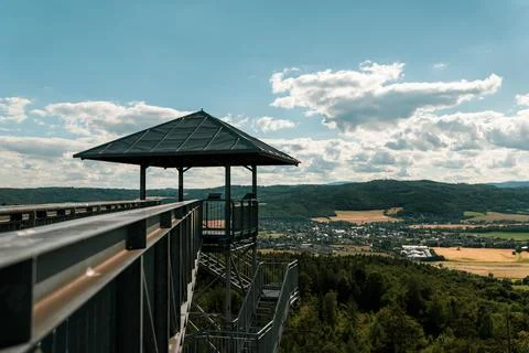 Metal structure of a modern observation tower with a roof overlooking a valley Фото