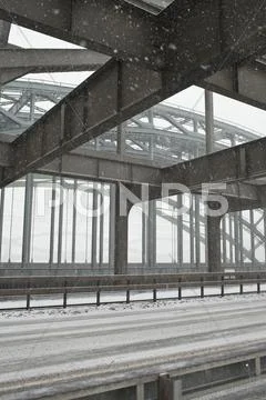 The Metal Structure Of A Road Bridge In A Snowstorm