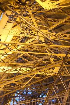 Metal structure of a roof with a complex shape on a sunny blue sky Stock Photos
