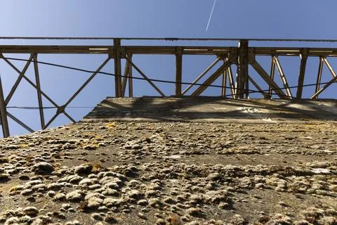 Metal structure tower with concrete base from coal mine cable cart industri.. Stock Photos