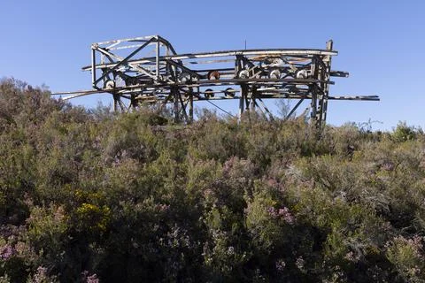 Metal structure tower with concrete base from coal mine cable cart industri.. Stock Photos