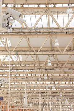 Metal structure of a white ceiling seen from below in the interior Stock Photos