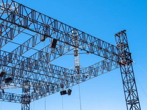 Metal structures assembled into a scene against a blue sky Stock Photos