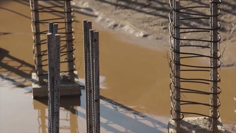 Metal structures, construction site, puddles, human shadow Stock Footage 280969583